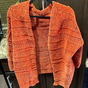 Orange cardigan. Soft material.